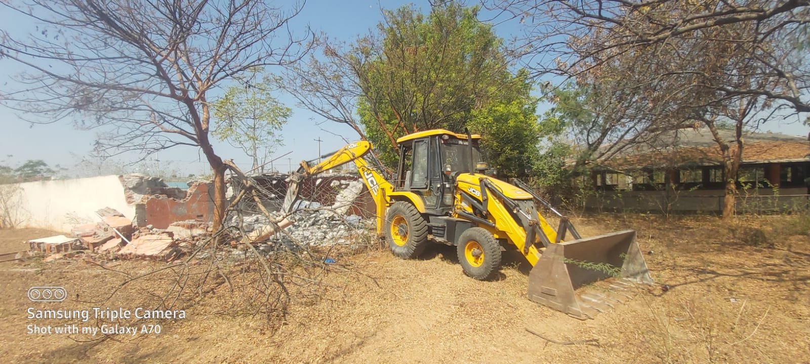 JCB excavator at demolition site in Hyderabad - MS Demolishers