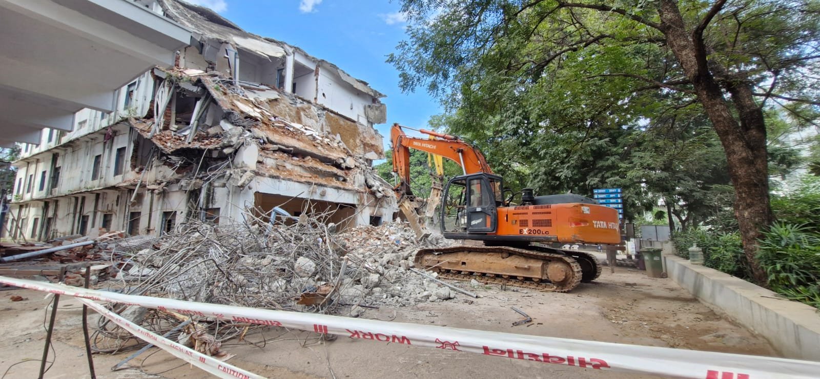 JCB excavator at demolition site in Vijayawada